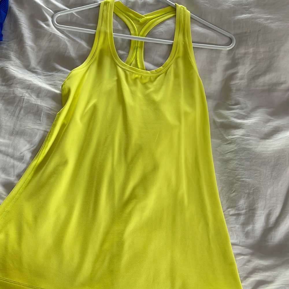 Yellow lululemon tank, I think size 8. Perfect condition.